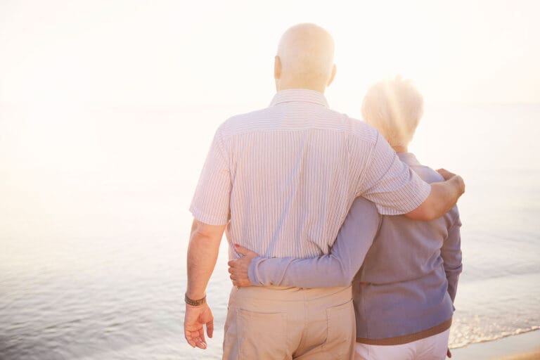 Featured image for Veteran Spouse Benefits, showing a Veteran and his spouse standing arm by arm