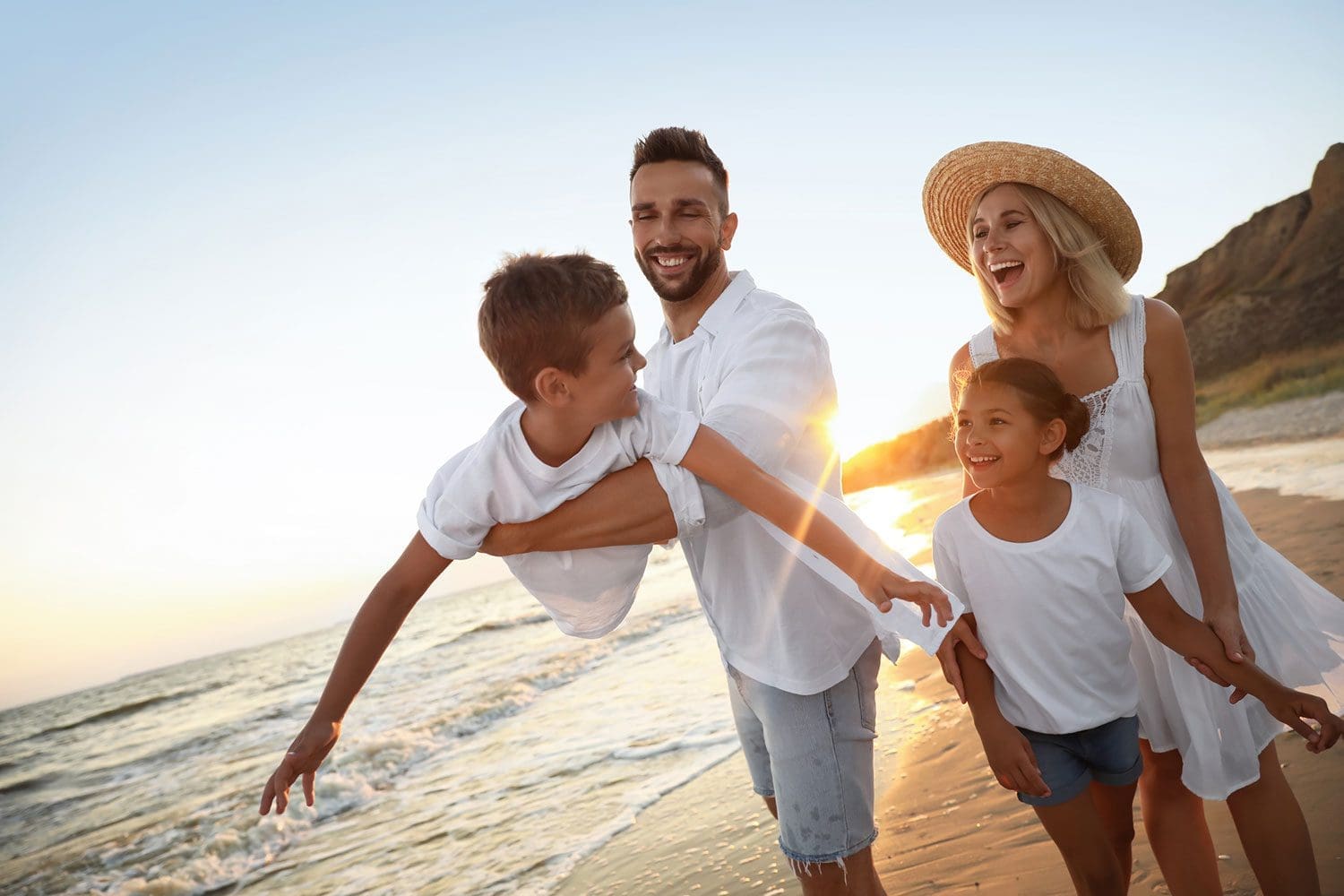 Featured image for American Forces Travel, showing a happy military family on vacation by the beach