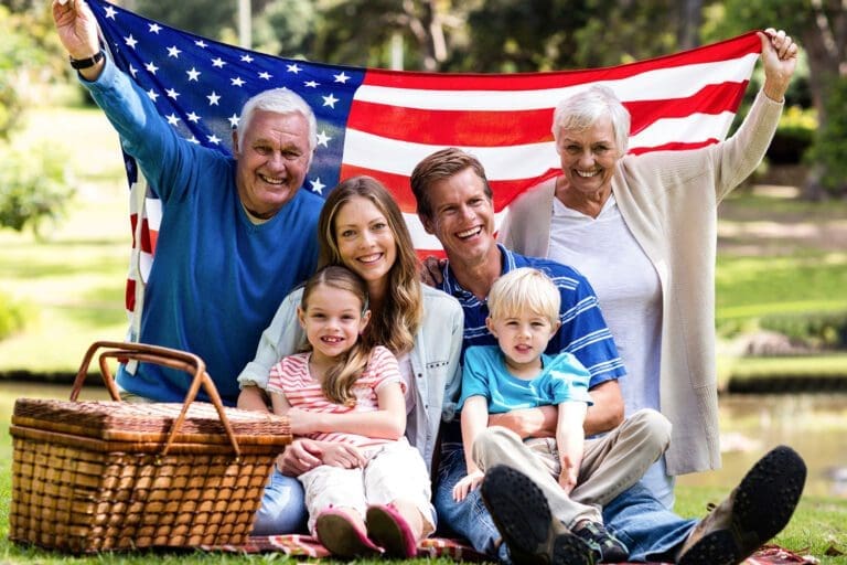 Featured image for Veterans' Group Life Insurance – also called VGLI – showing a happy military family with a flag of the United States