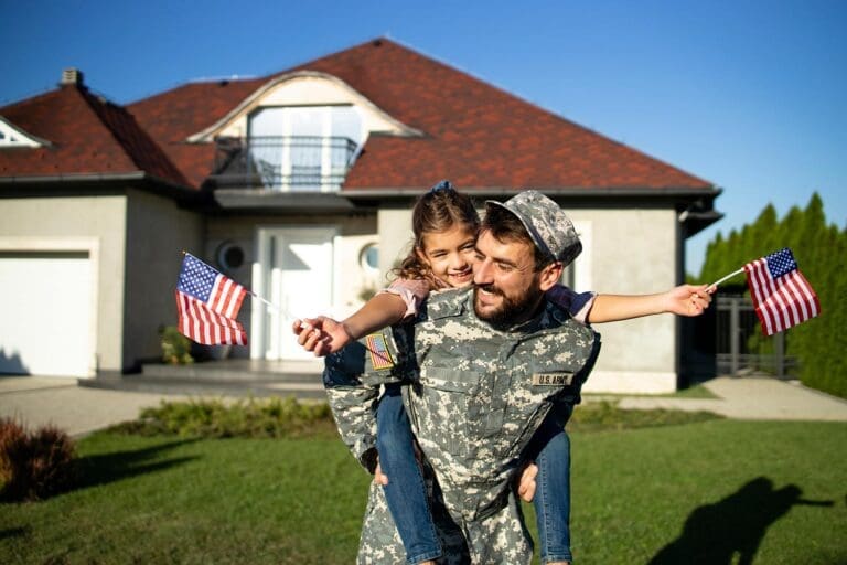 Featured image for VA Cash Out Refinance, showing a happy soldier with his daughter in front of their home